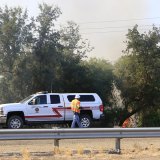 A Kings County Fire vehicle parked on Highway 198.